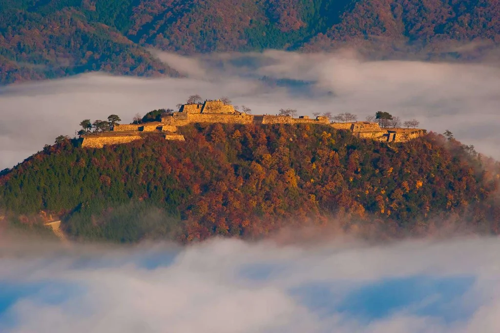 Takeda Castle on hill in clouds, Hyogo, Japan